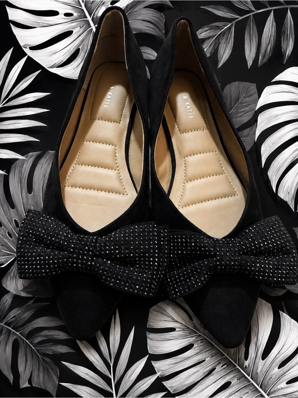 Kellytoy Black Pointed-Toe Flats with Bow Accent